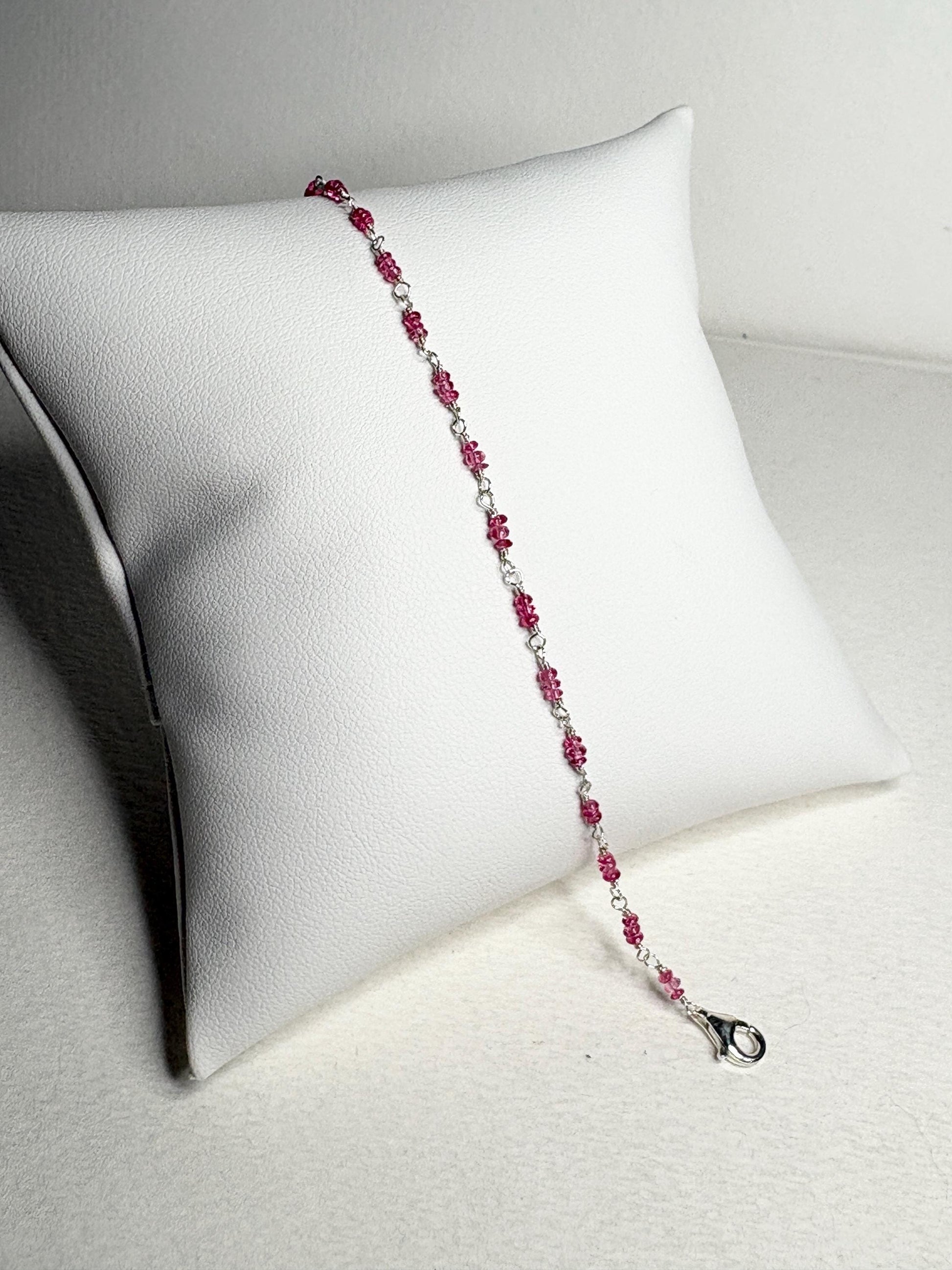 Sterling silver bracelet with hot pink spinel beads and a lobster clasp.
