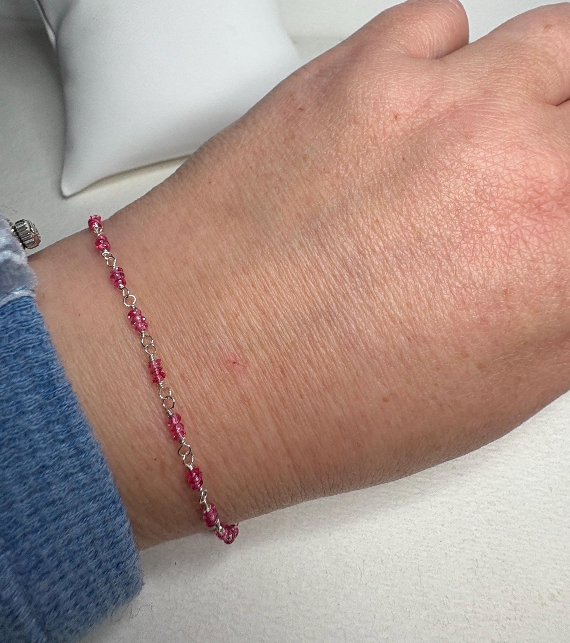 Sterling silver bracelet with hot pink spinel beads.