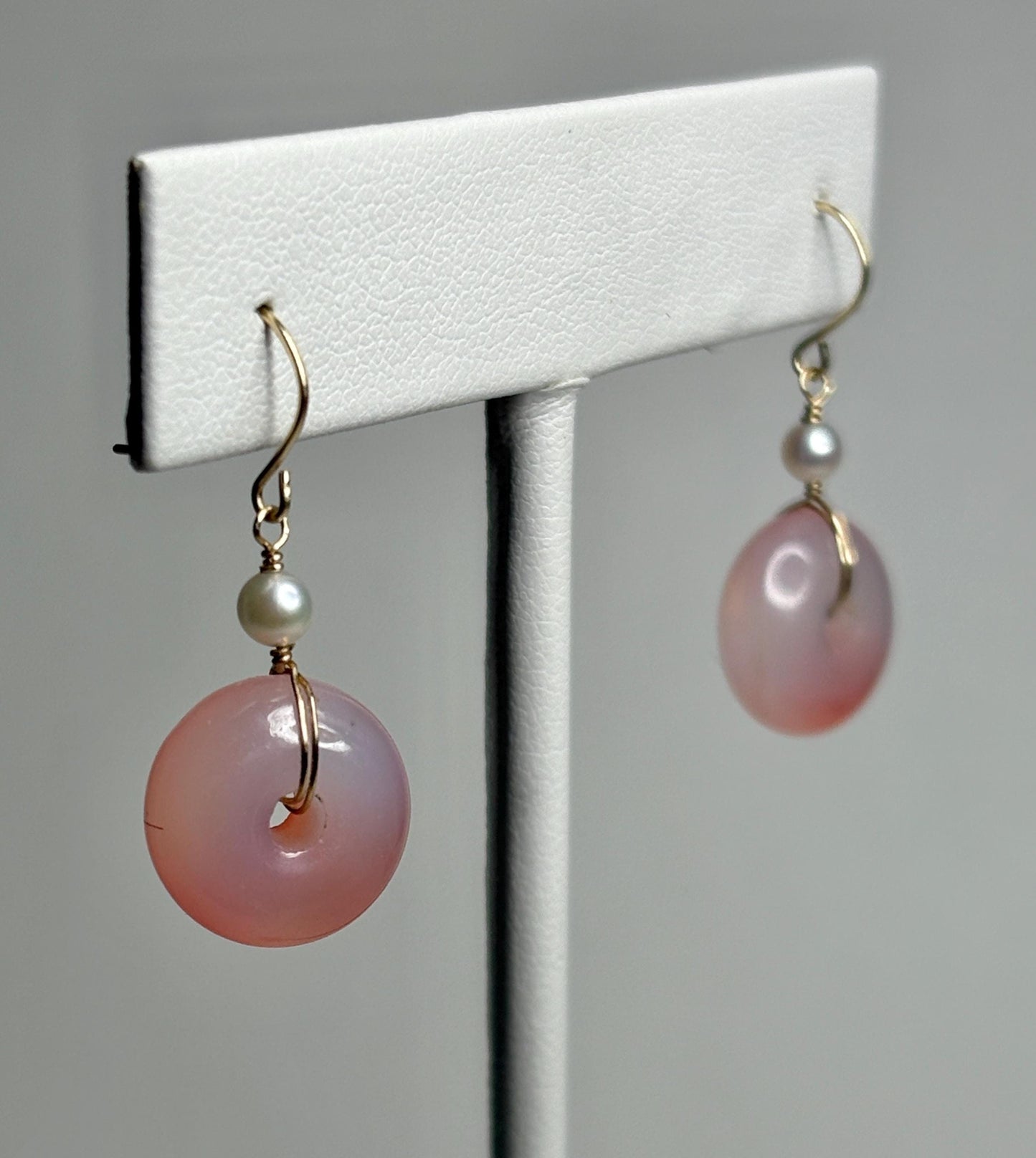 14k gold dangle earrings with pink ombre agate donuts and Akoya pearls.