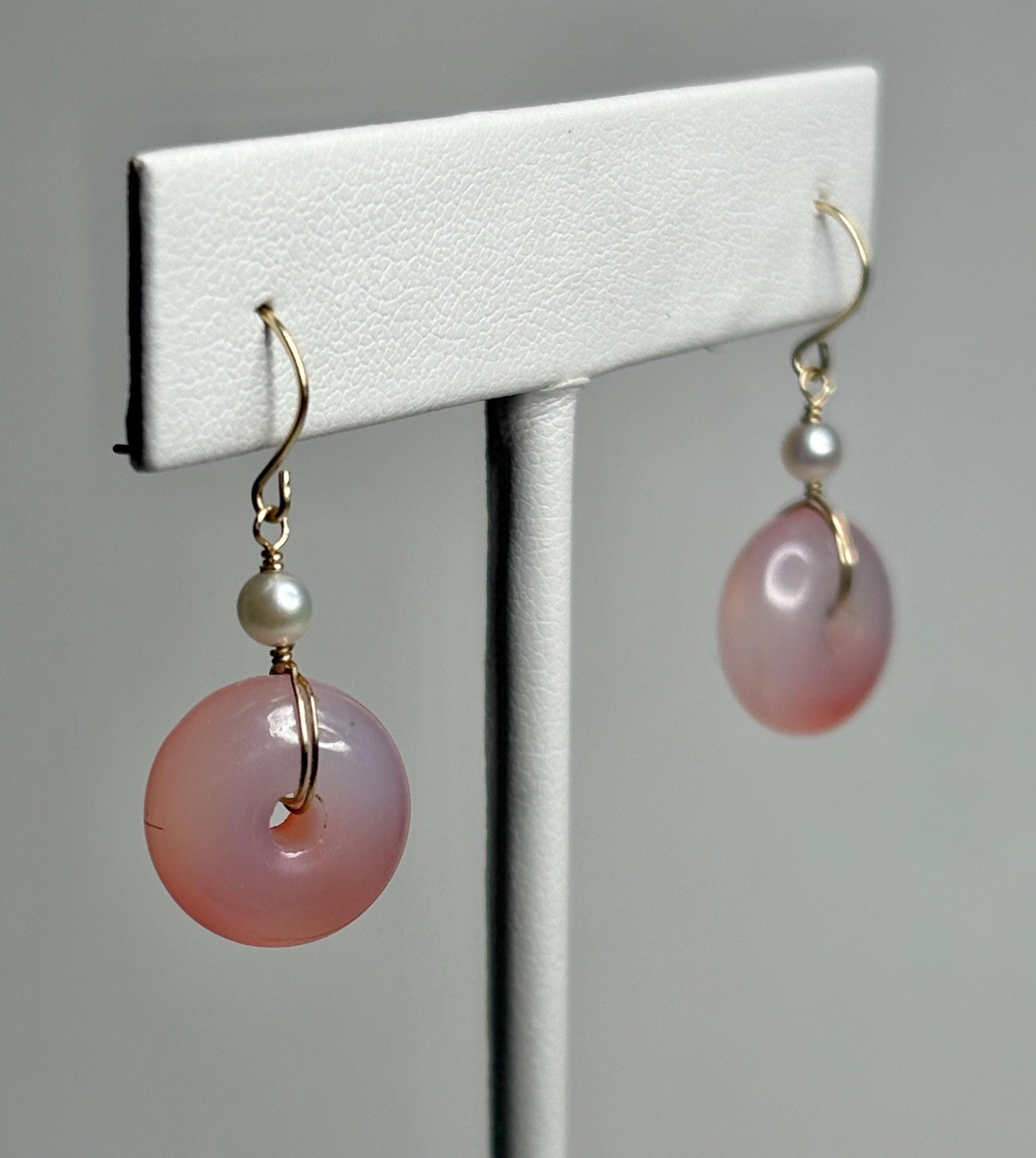 14k gold dangle earrings with pink ombre agate donuts and Akoya pearls.