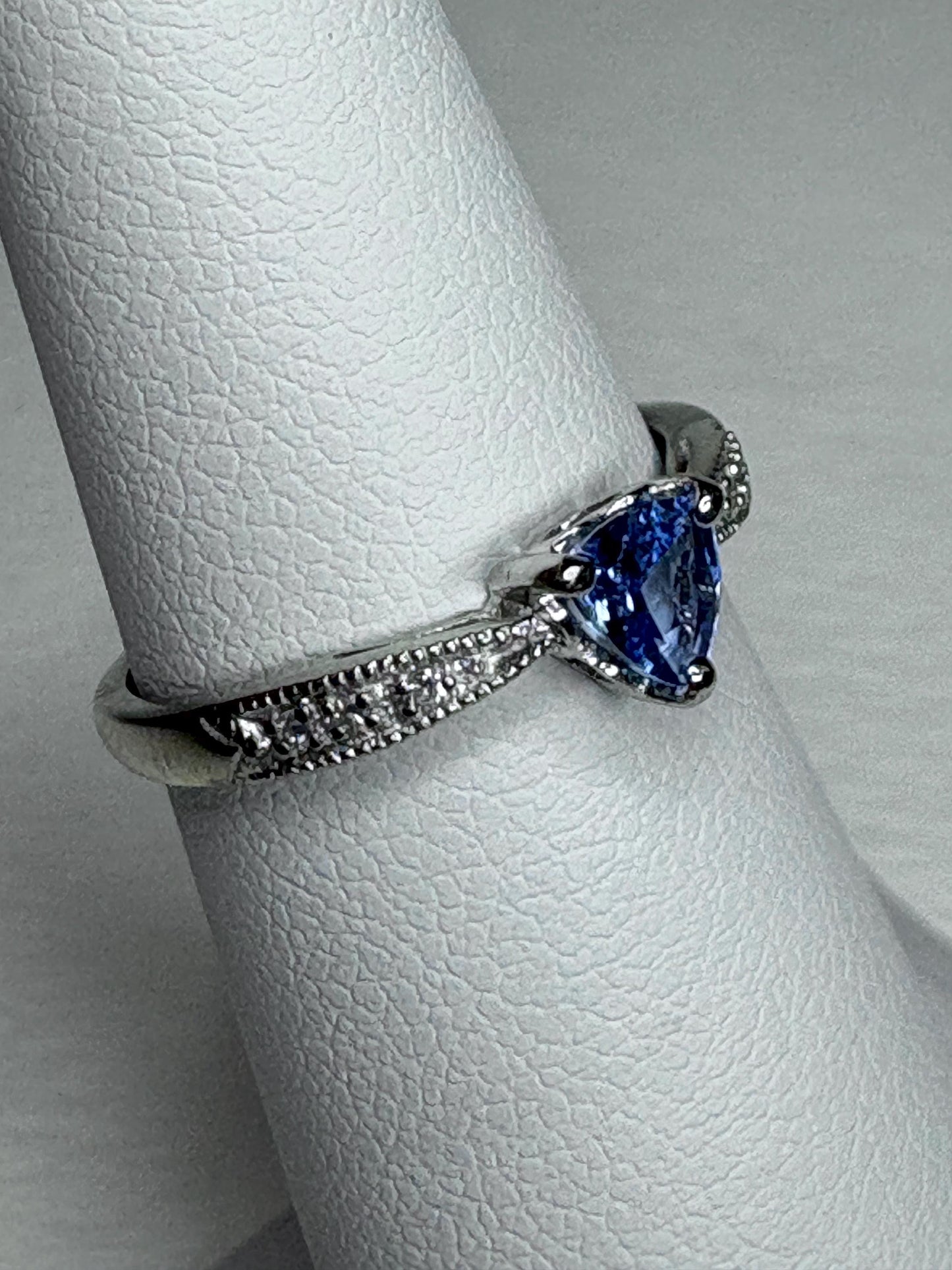 Tanzanite trillion heart ring with diamonds in 10k white gold.