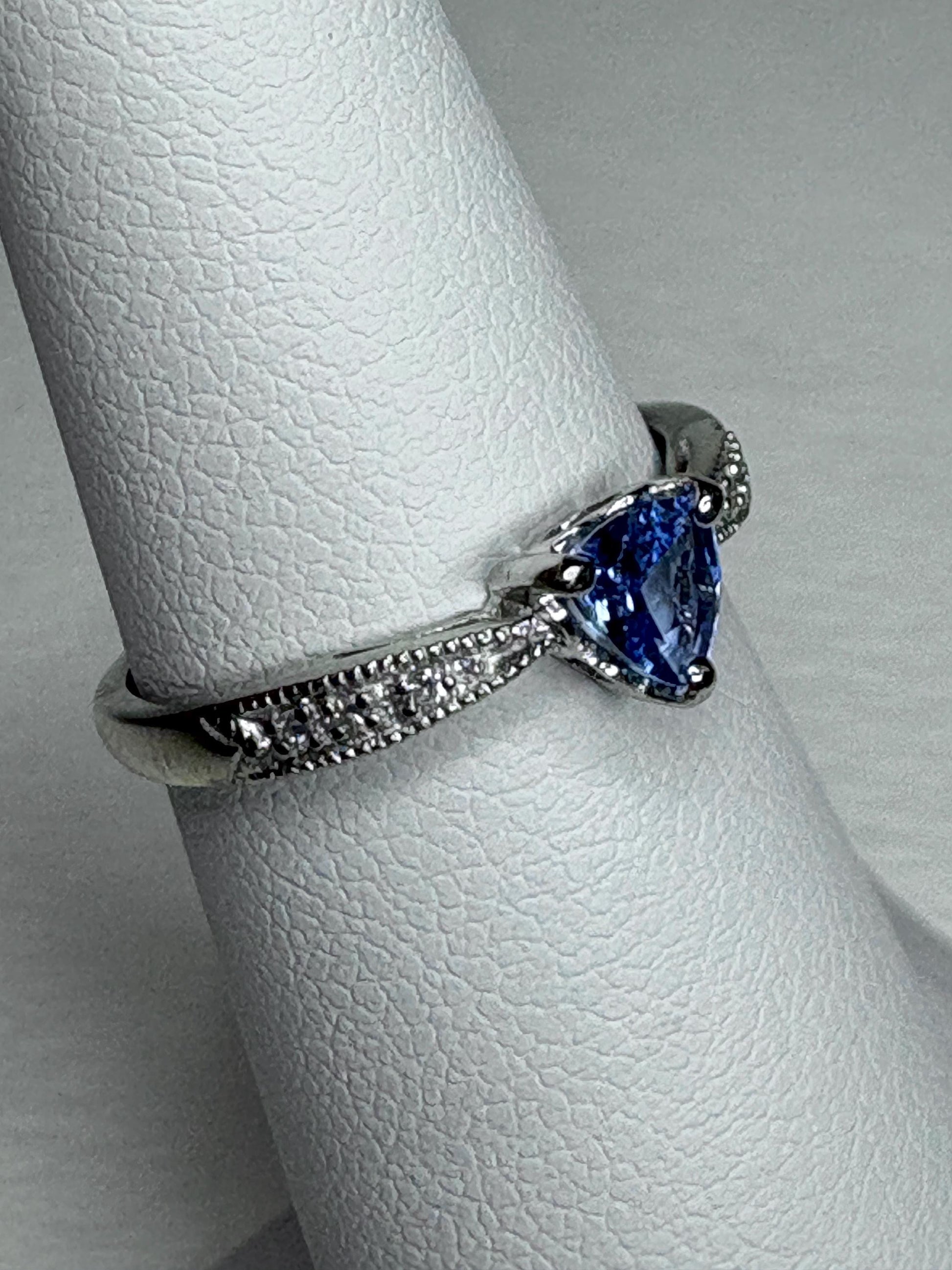 Tanzanite trillion heart ring with diamonds in 10k white gold.