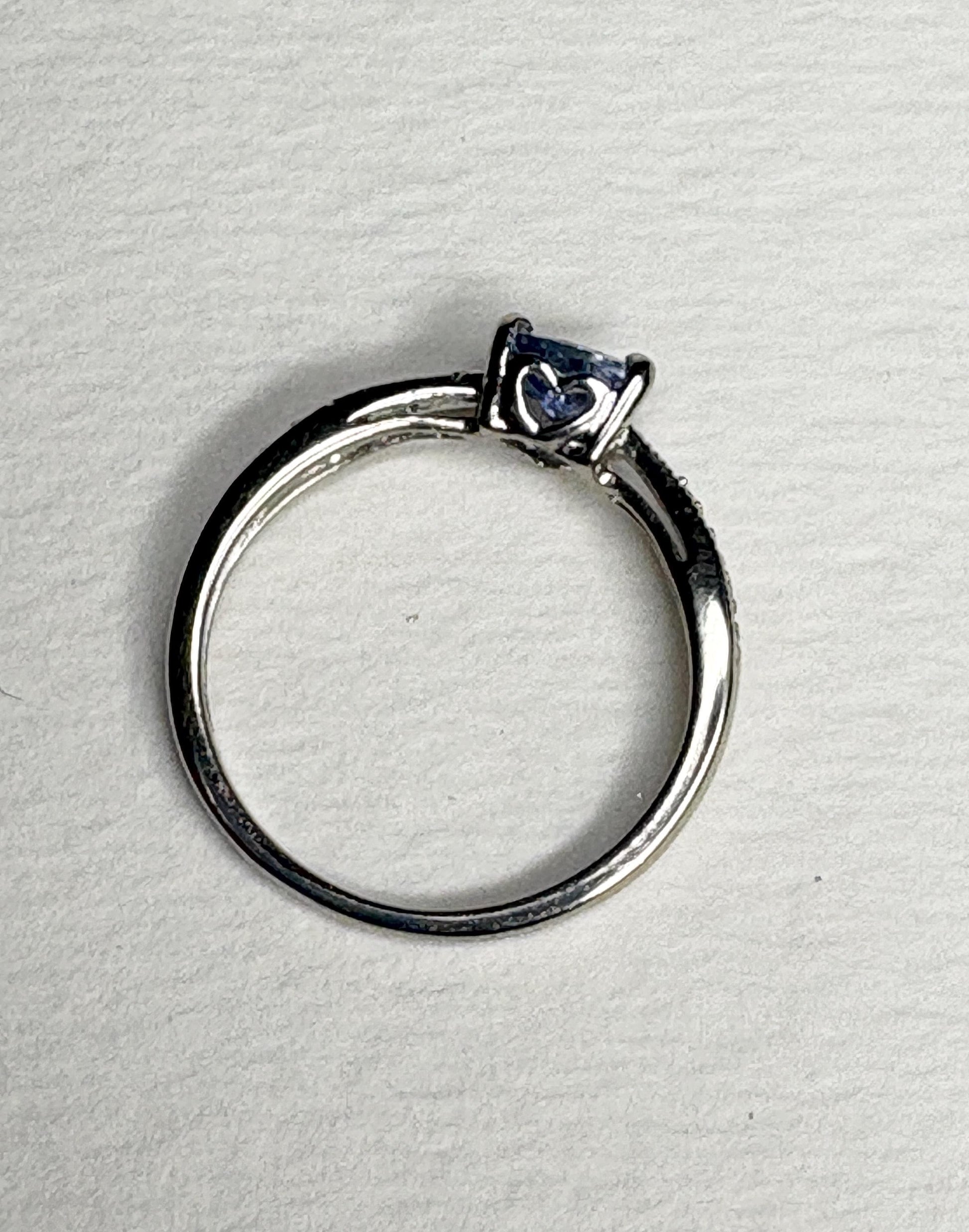 Tanzanite trillion heart ring with diamonds in 10k white gold.