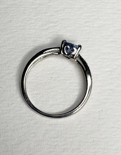 Tanzanite trillion heart ring with diamonds in 10k white gold.