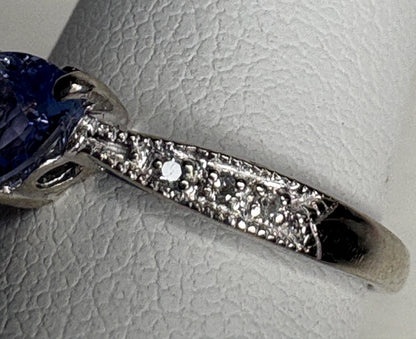 Tanzanite trillion heart ring with diamonds in 10k white gold.