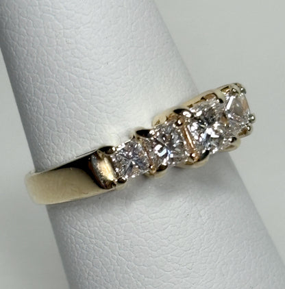 14k yellow gold anniversary band with five princess-cut diamonds.