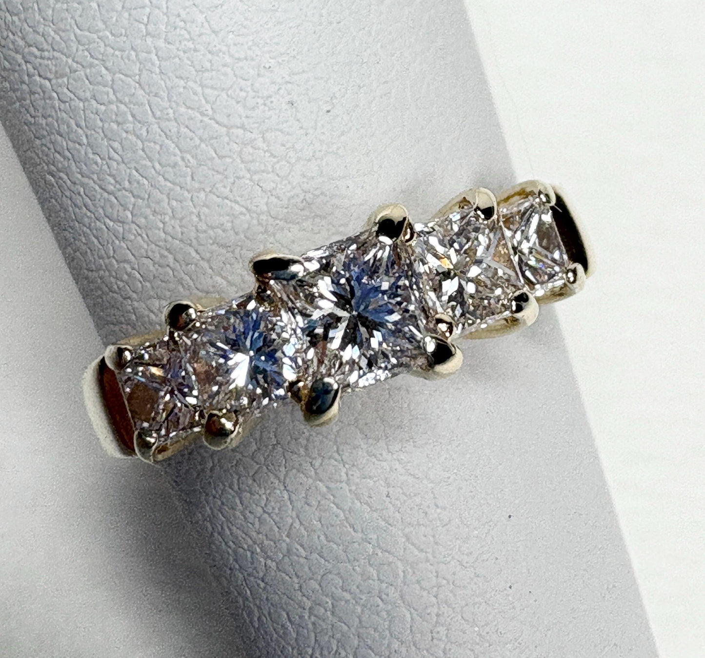 14k yellow gold anniversary band with five princess-cut diamonds.