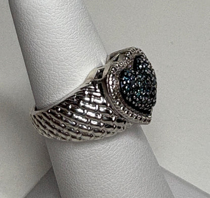 Sterling silver ring with a blue diamond pave heart and quilted band.