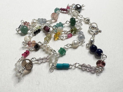 Sterling silver necklace with a variety of colorful natural gemstones.