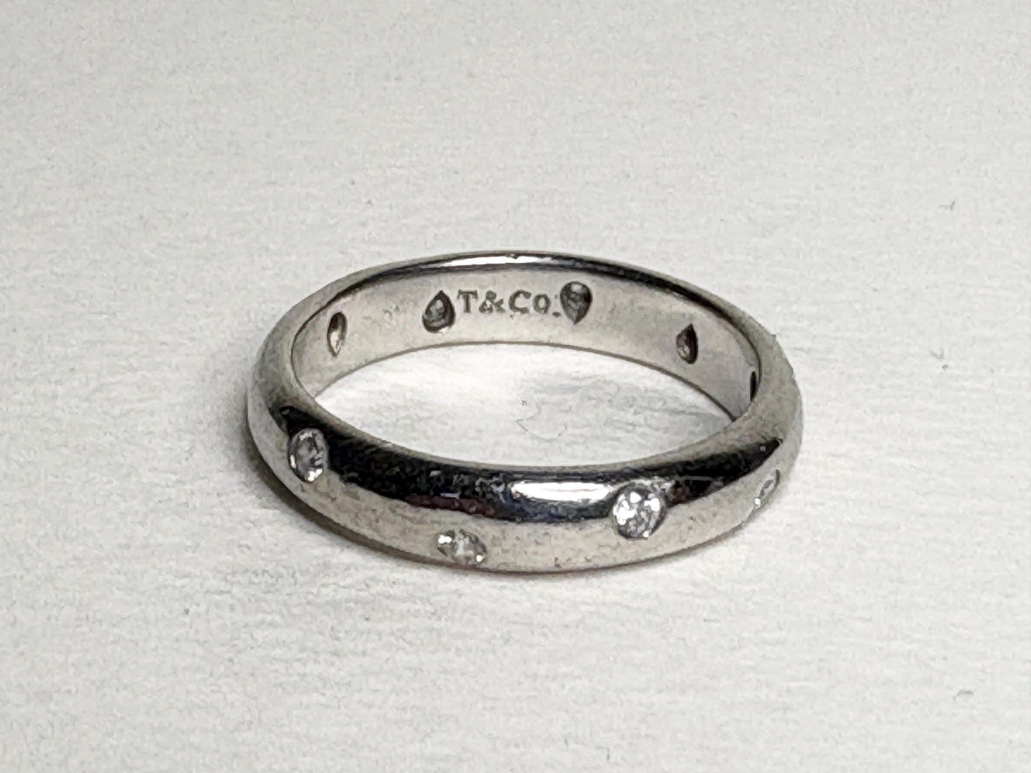 Tiffany & Co. platinum eternity band ring with diamonds.