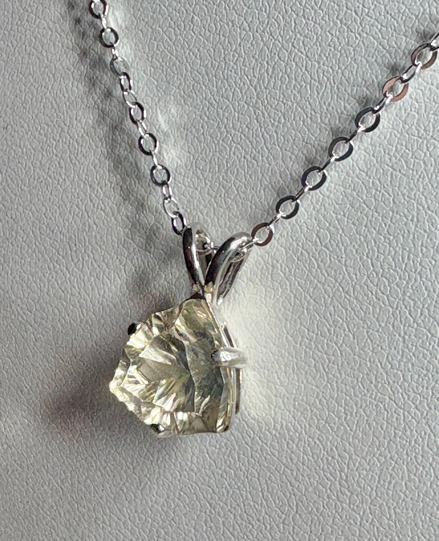 Sterling silver pendant necklace with a 10mm concave cut trillion Oregon sunstone.