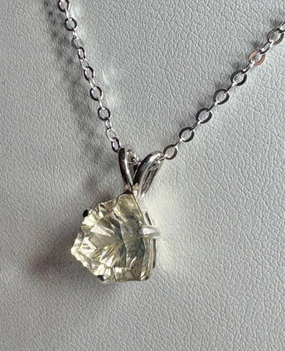Sterling silver pendant necklace with a 10mm concave cut trillion Oregon sunstone.