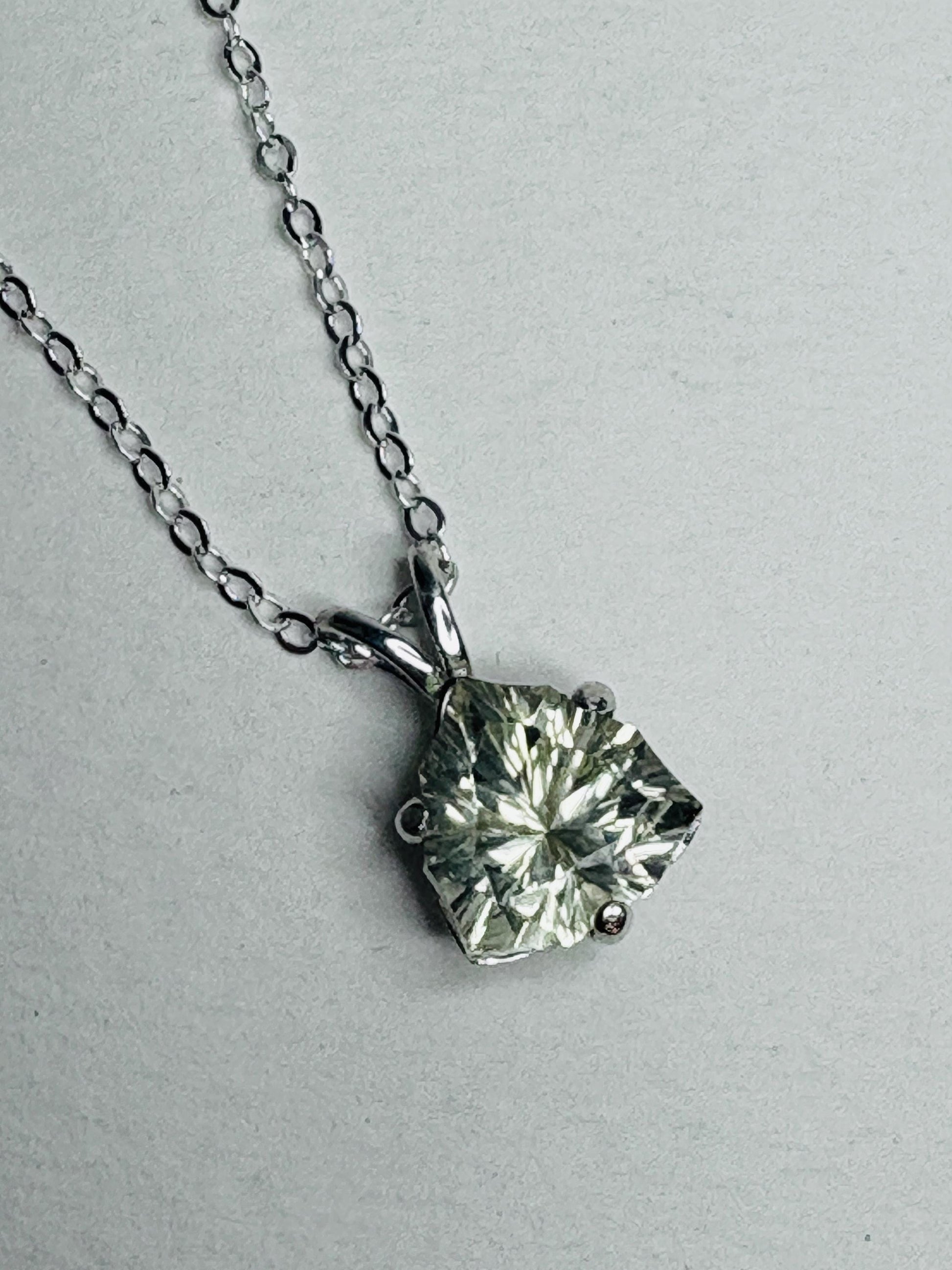Sterling silver pendant necklace with a 10mm trillion-cut Oregon sunstone.