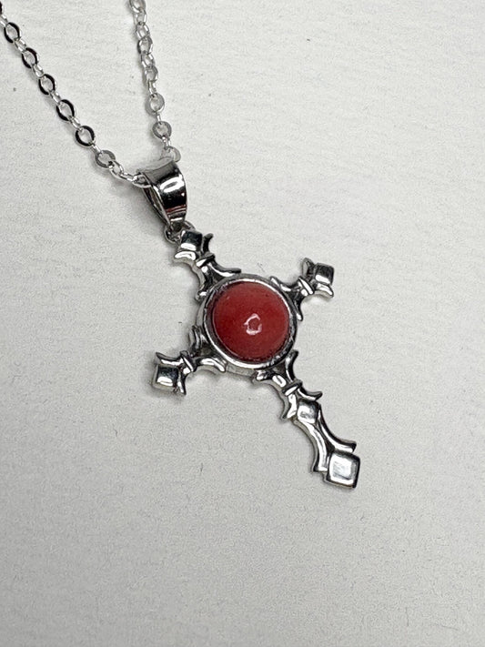Sterling silver cross pendant necklace with a coral-colored Oregon opal.