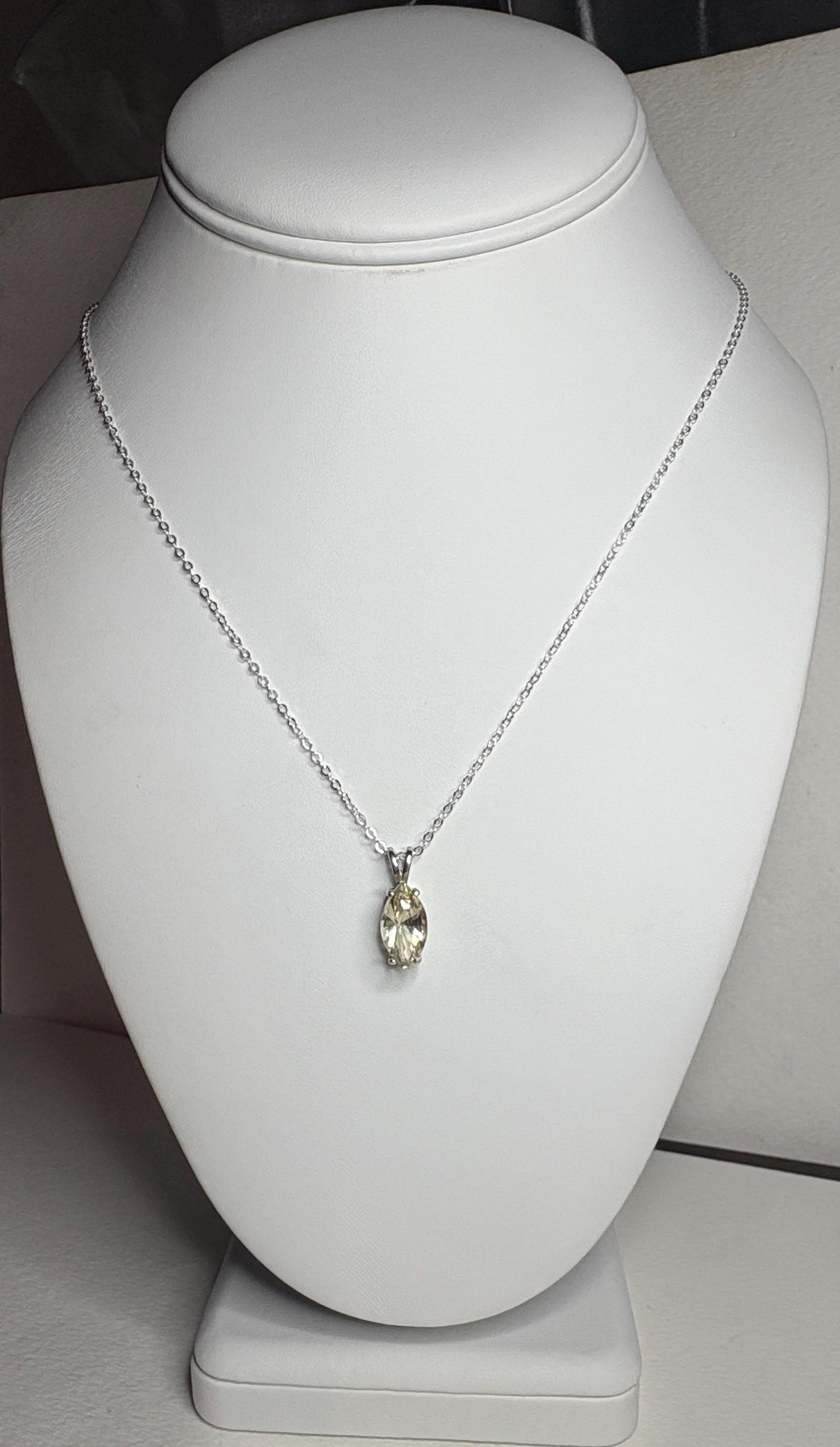 Sterling silver necklace with an 18-inch chain and a marquise-cut Oregon sunstone pendant.