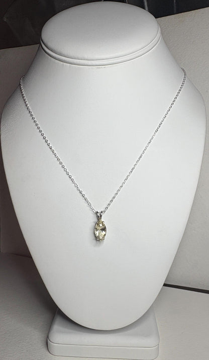 Sterling silver necklace with an 18-inch chain and a marquise-cut Oregon sunstone pendant.