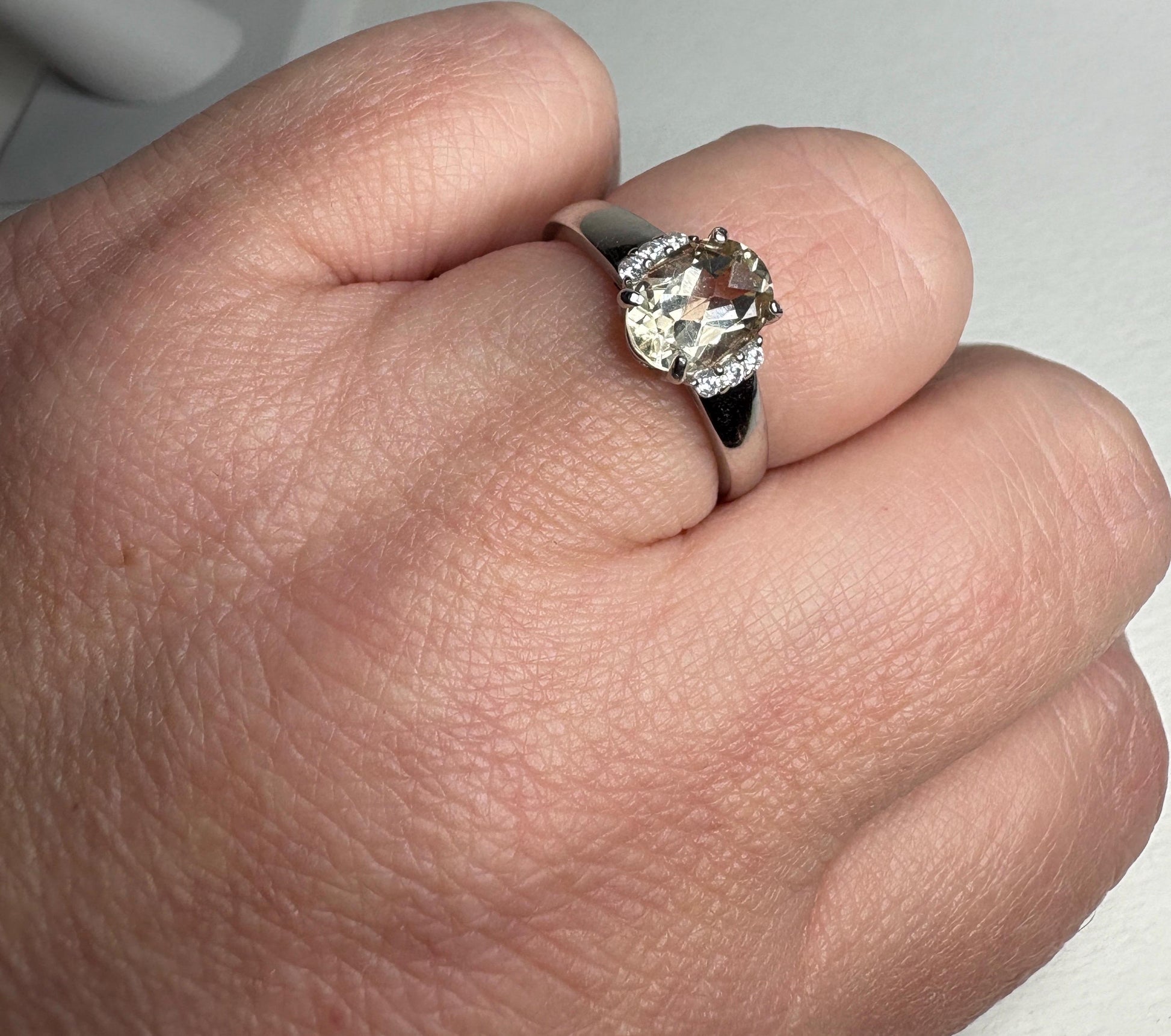 Sterling silver ring with an oval Oregon sunstone and accent crystals.