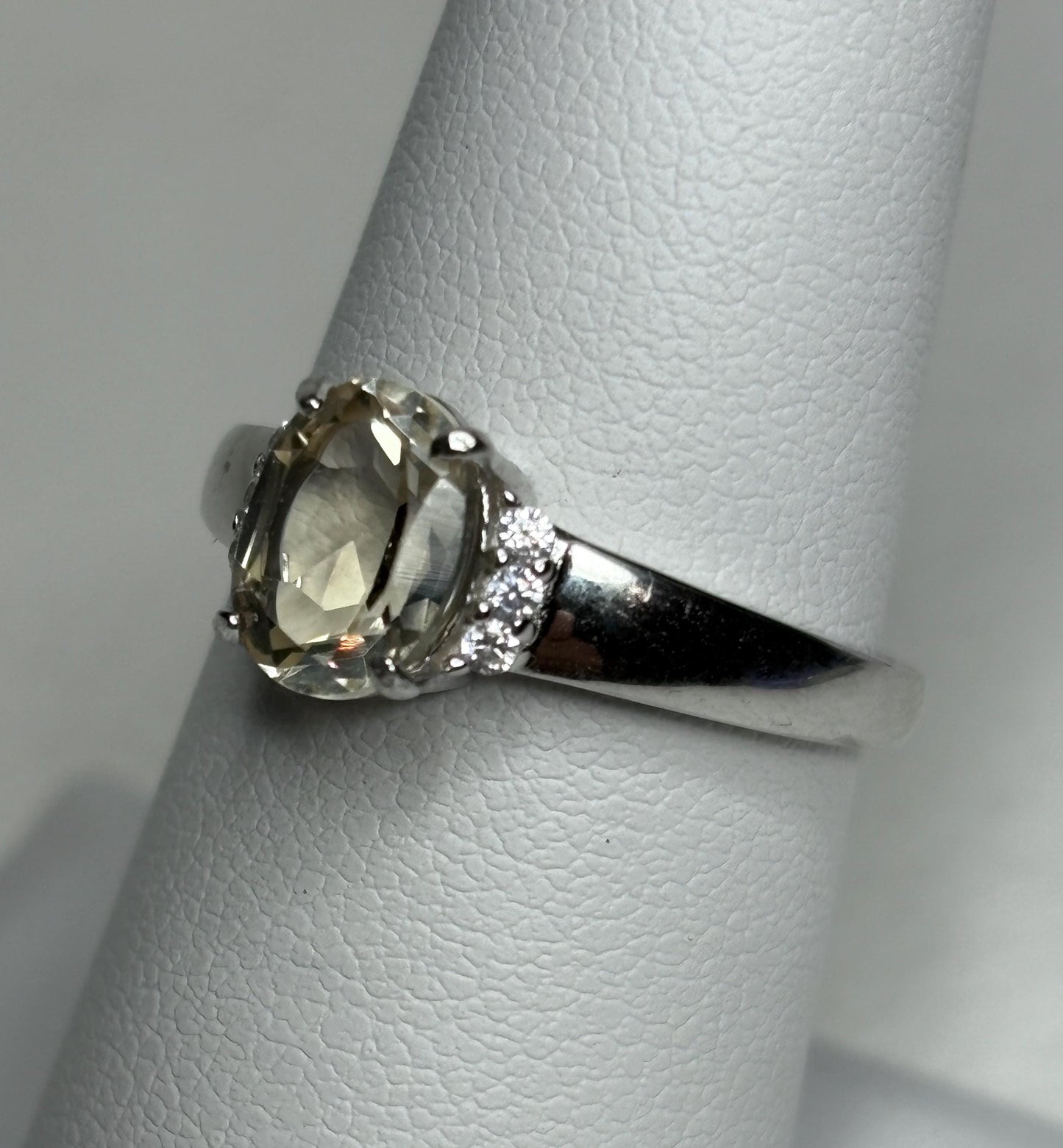 Sterling silver ring with an oval Oregon sunstone and accent crystals, size 7.