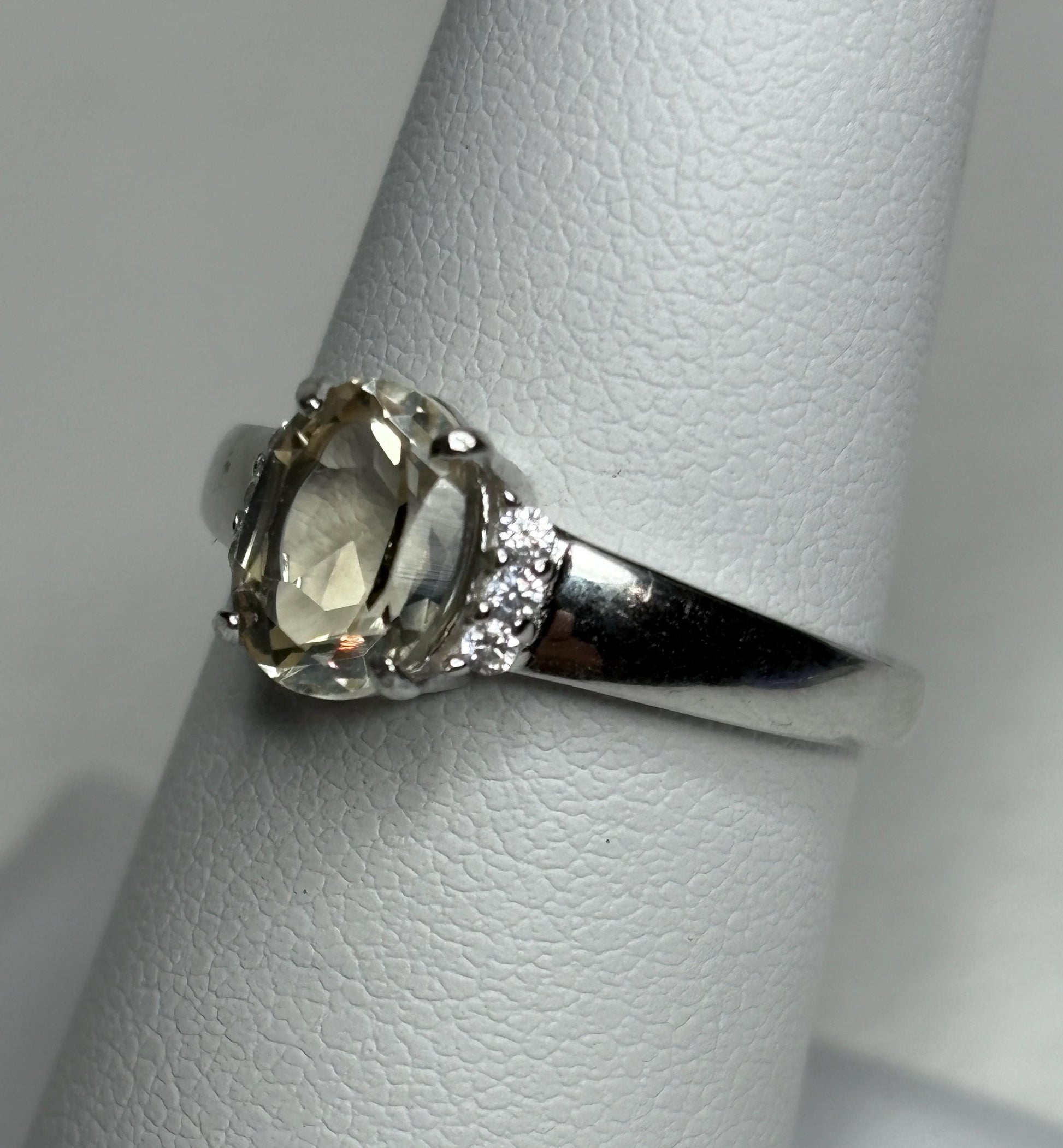 Sterling silver ring with an oval Oregon sunstone and accent crystals, size 7.