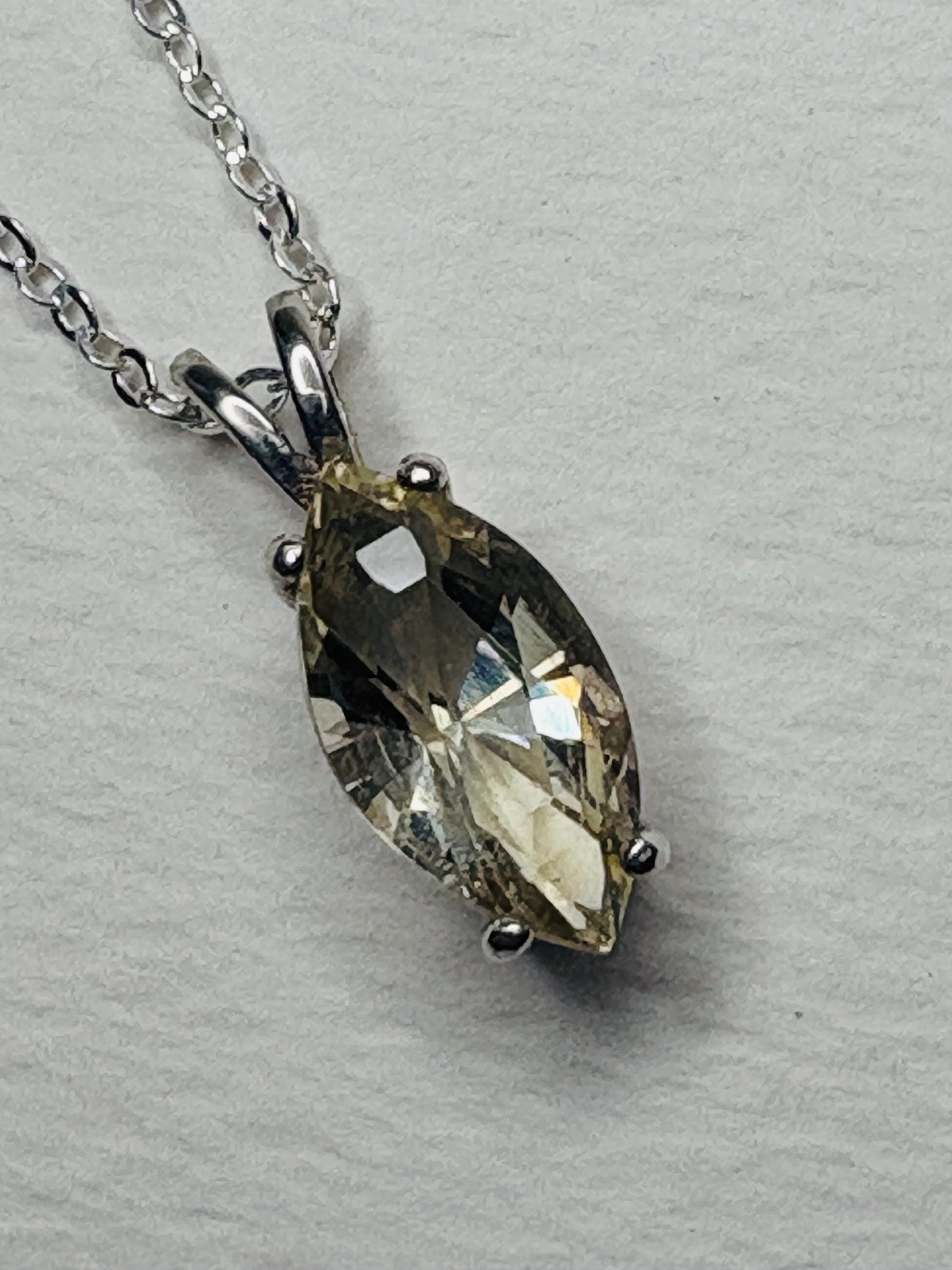 Marquise Oregon sunstone pendant necklace in sterling silver on an 18-inch chain.