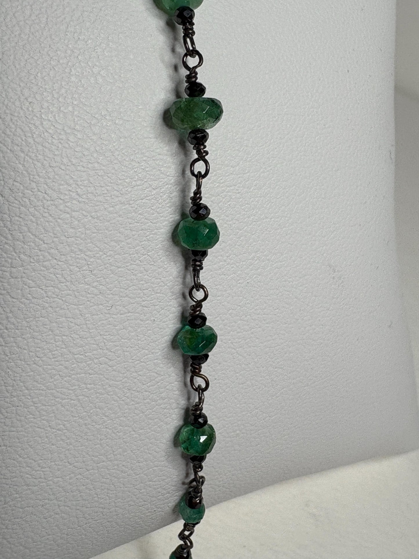 Oxidized sterling silver bracelet with faceted emeralds and black diamond beads.