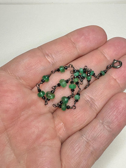 Oxidized sterling silver bracelet with natural emeralds and black diamond beads.