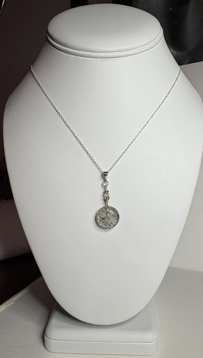 Sterling silver necklace with tourmalated quartz donut, Herkimer diamond, and tourmaline beads.