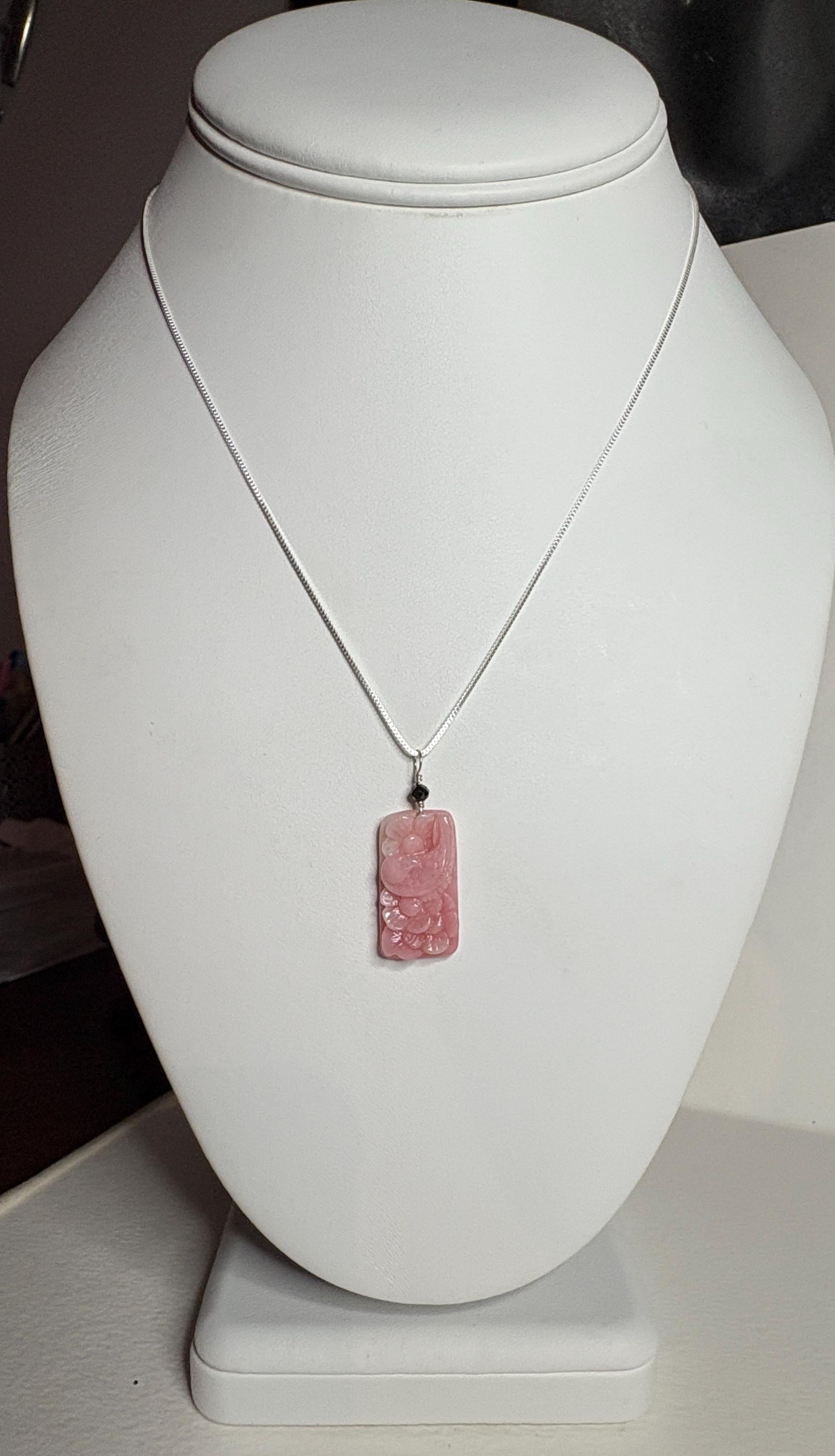 Peruvian pink opal pendant with carved dove and blossoms on a sterling silver chain.