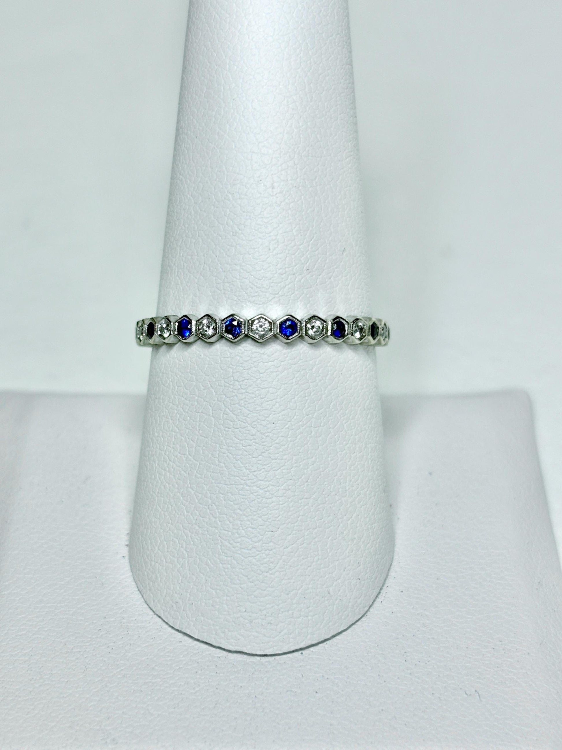 A 14k white gold ring with alternating blue sapphires and diamonds in a honeycomb hexagon pattern.