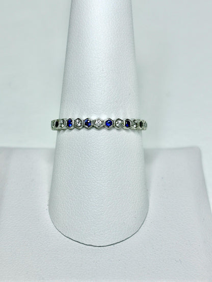 A 14k white gold ring with alternating blue sapphires and diamonds in a honeycomb hexagon pattern.