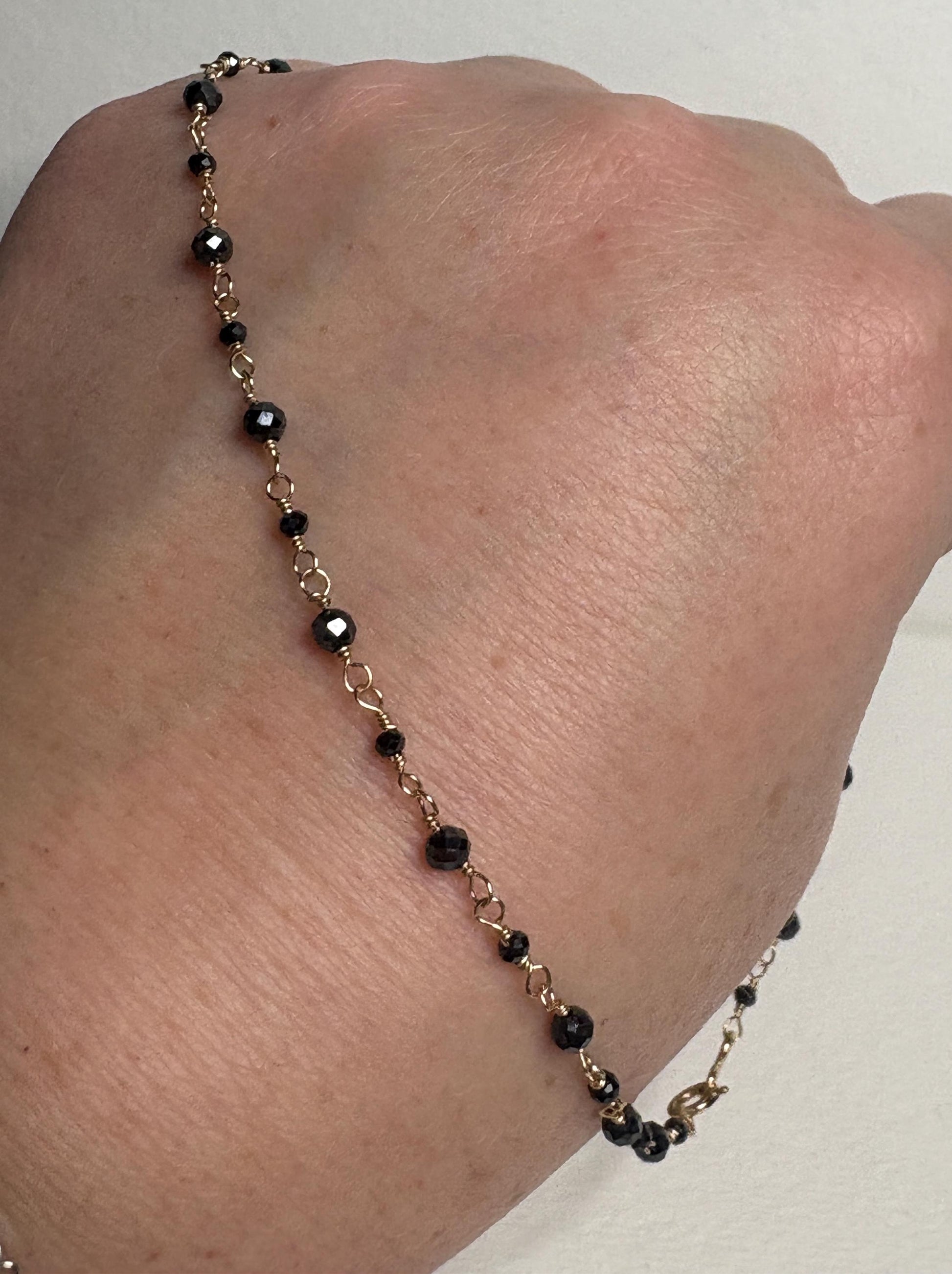 14k gold necklace with 2-3mm natural black diamond beads.