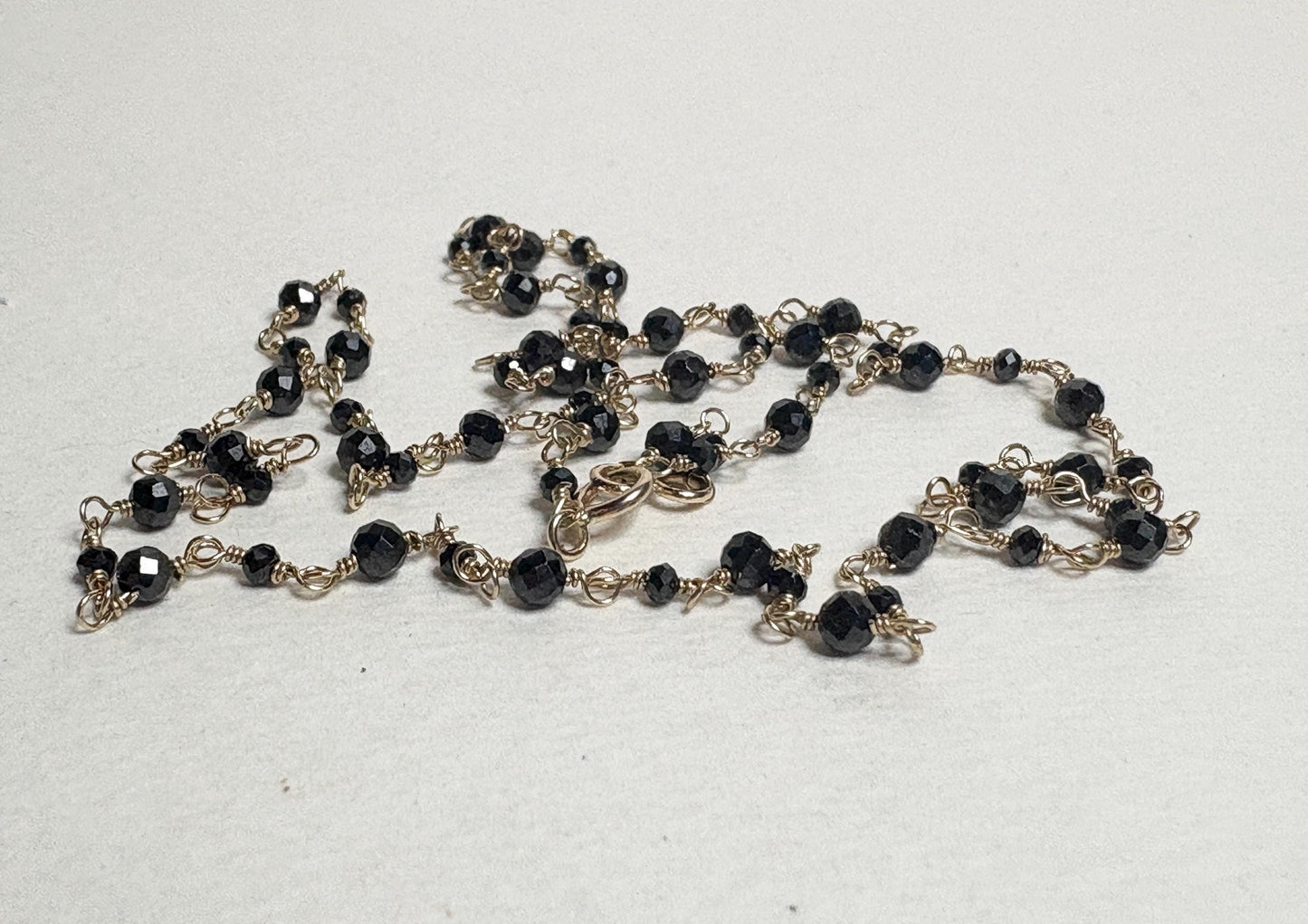 14k gold necklace with 2-3mm natural black diamond beads.