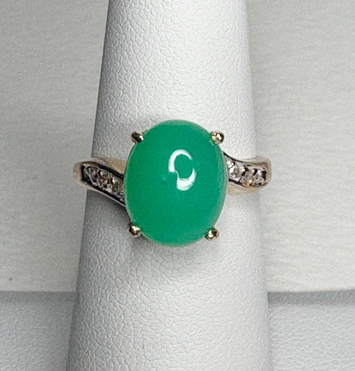 14k gold ring with a green chrysoprase stone and diamond accents.