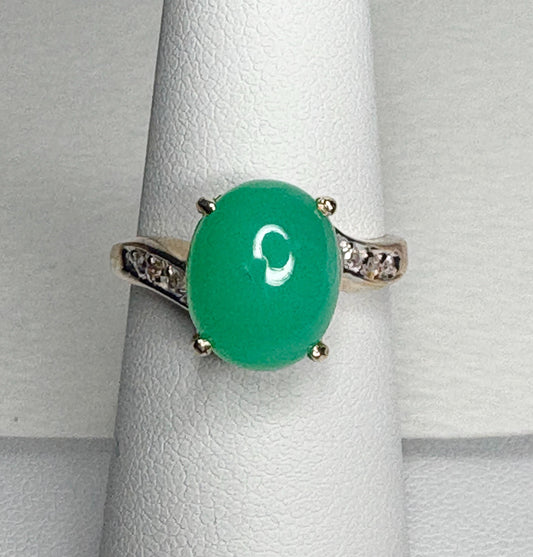 14k gold ring with a green chrysoprase stone and diamond accents.