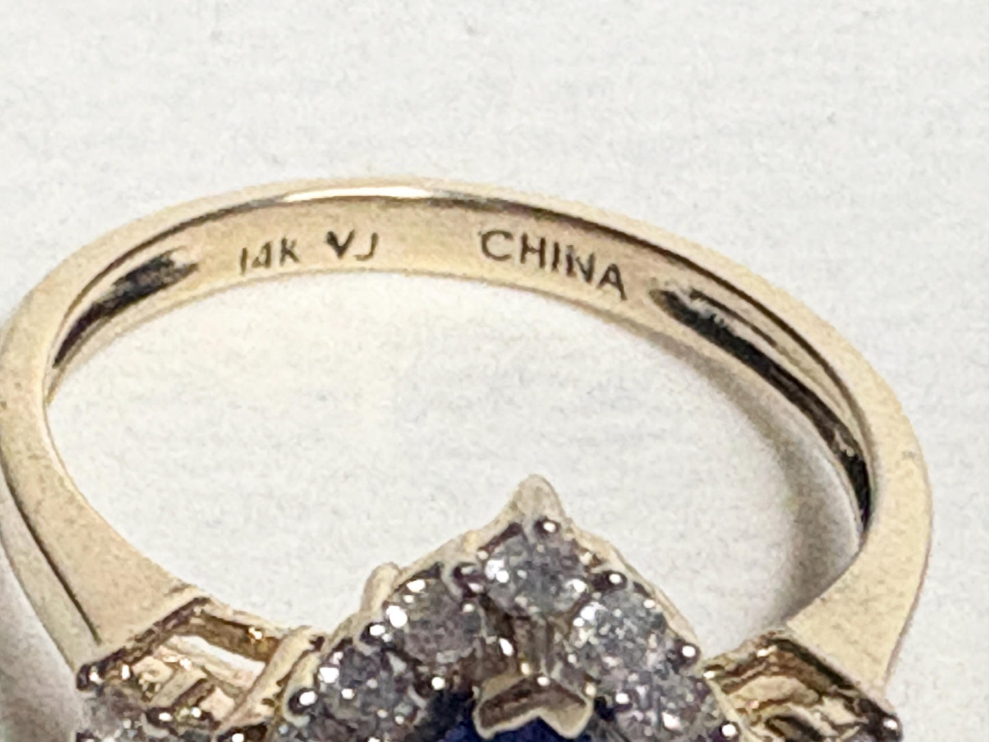14k gold ring with tanzanite and diamonds, marked VJ CHINA.