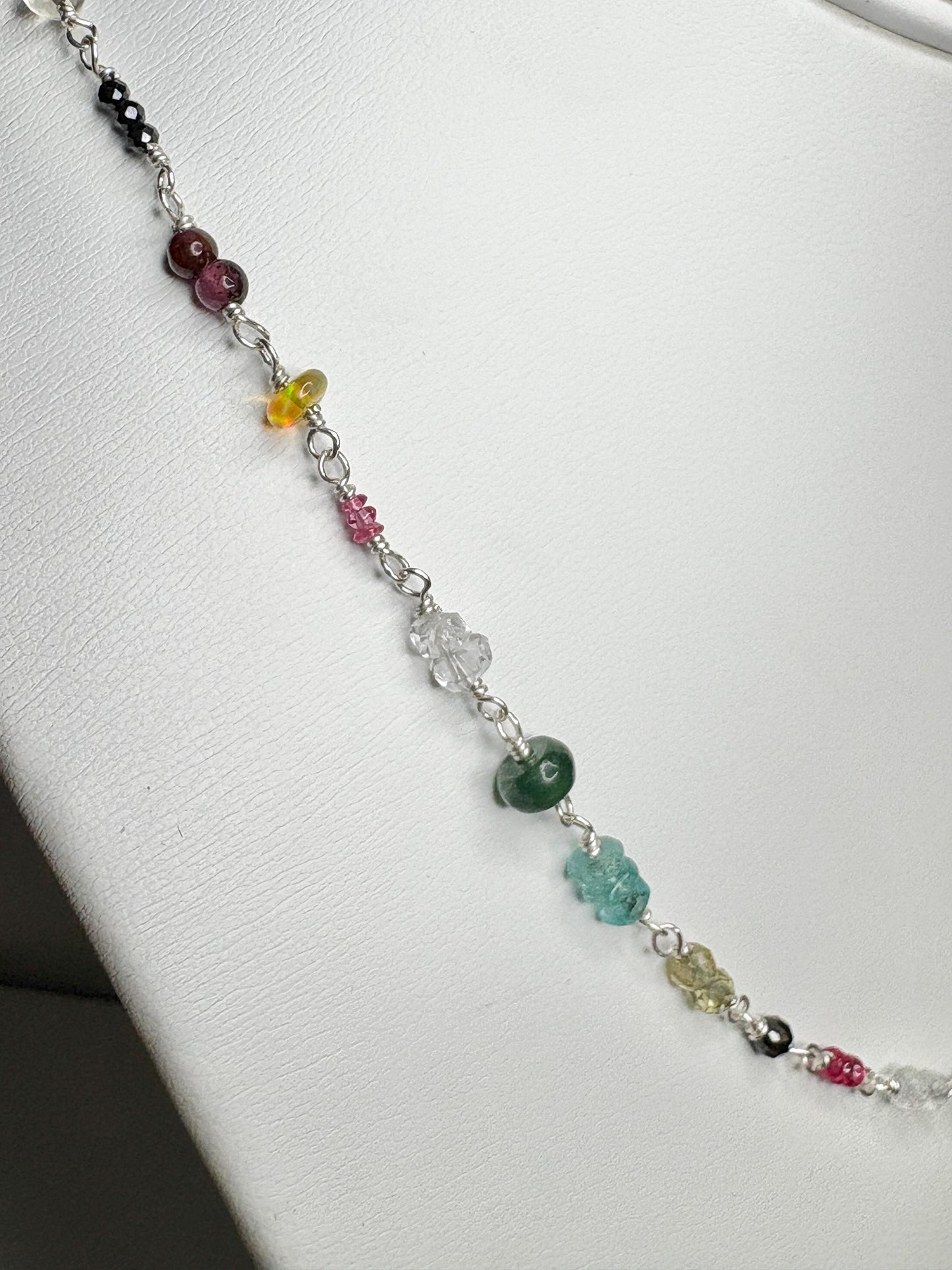 Sterling silver necklace with colorful natural gemstones.