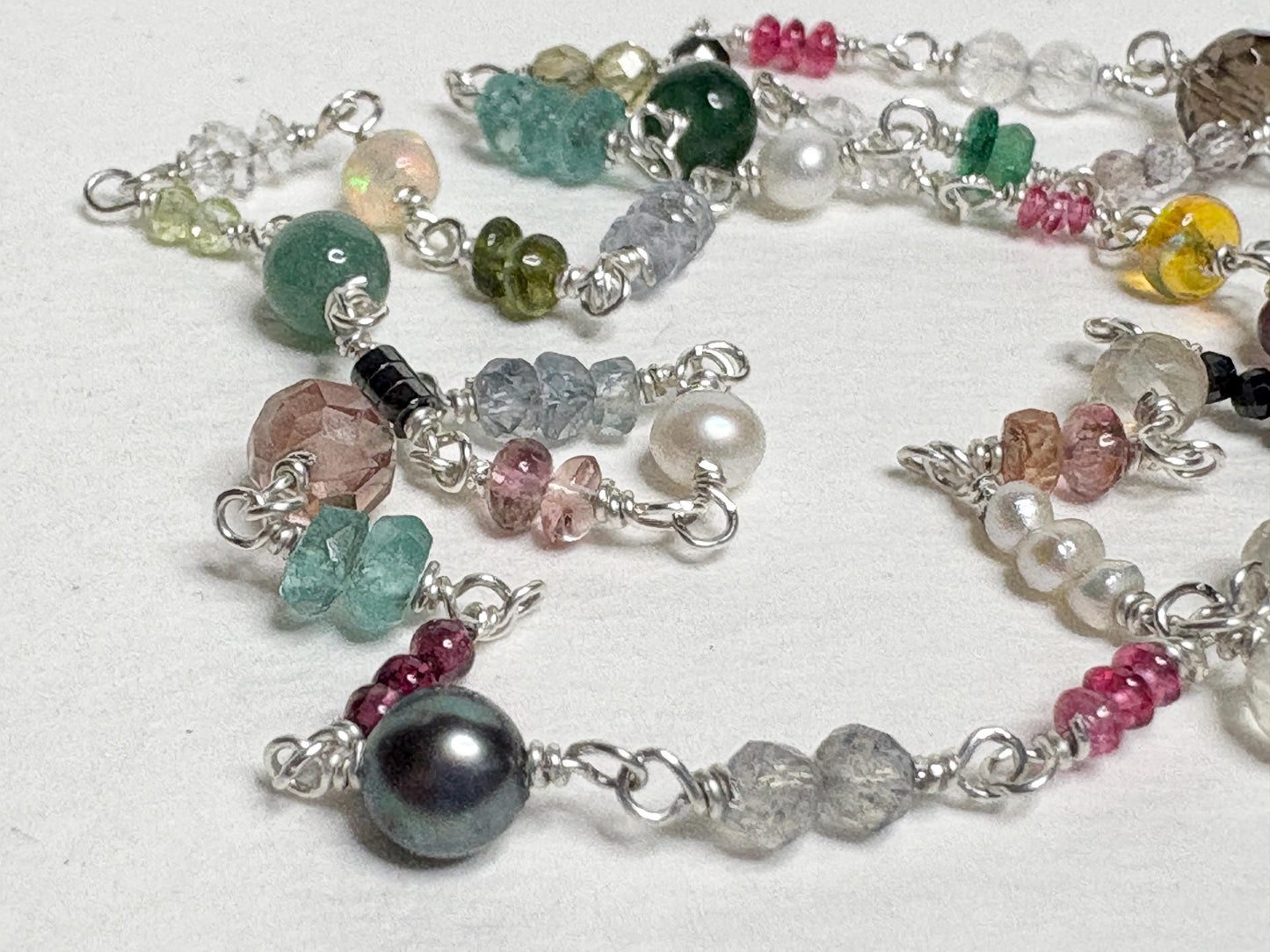 Sterling silver necklace with colorful natural gemstones and pearls.