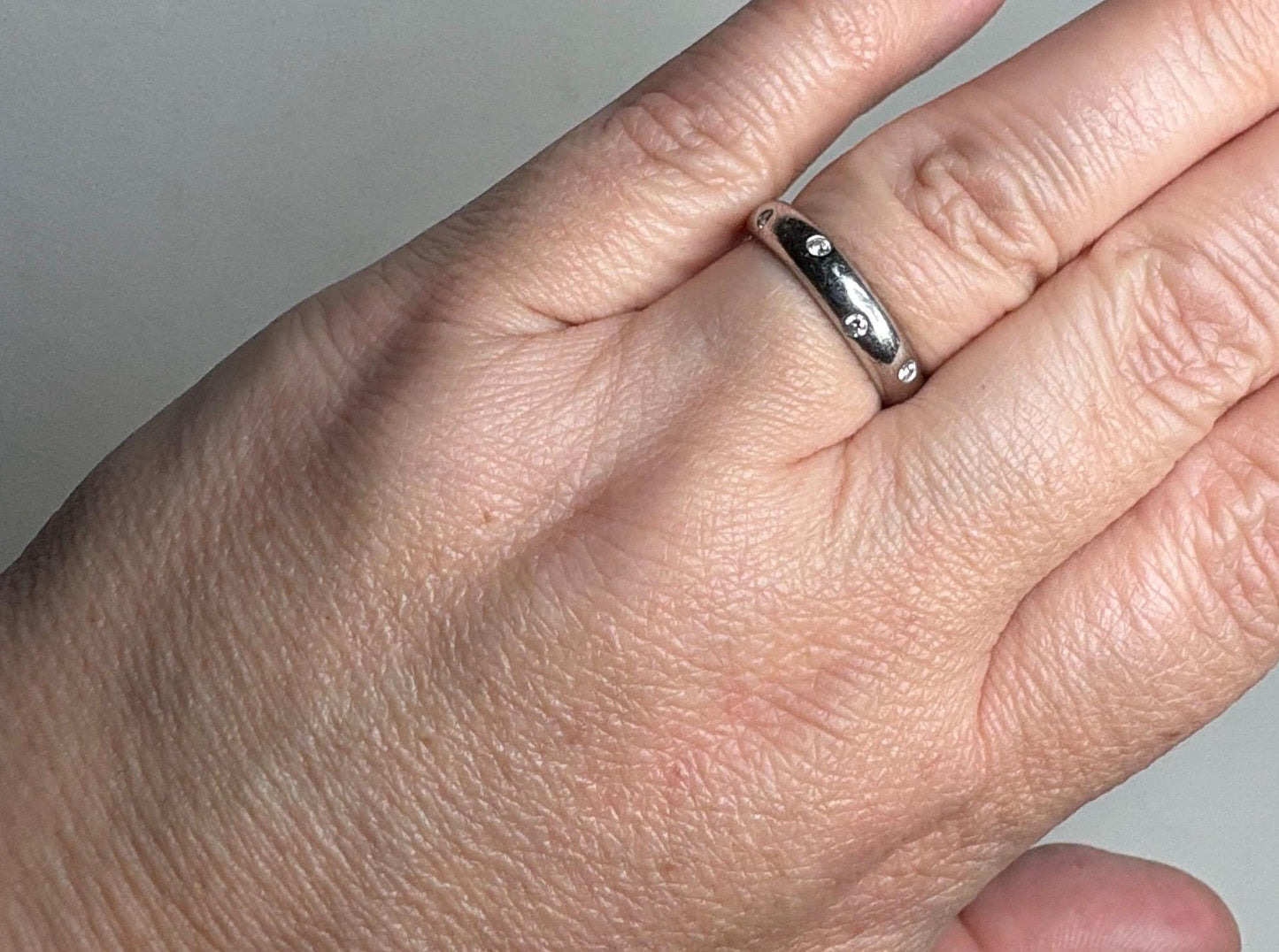 Tiffany & Co. platinum eternity band ring with diamonds.