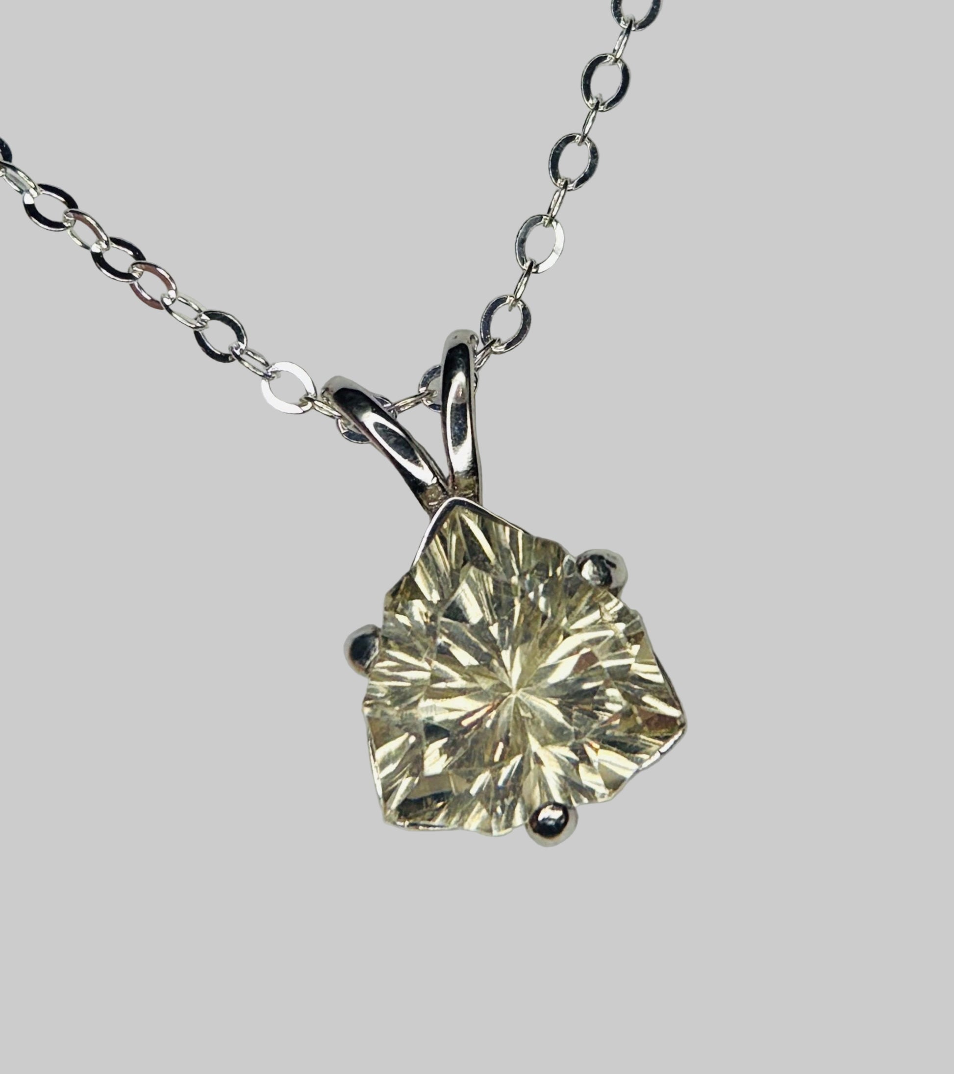 Sterling silver pendant necklace with a 10mm trillion-cut Oregon sunstone.