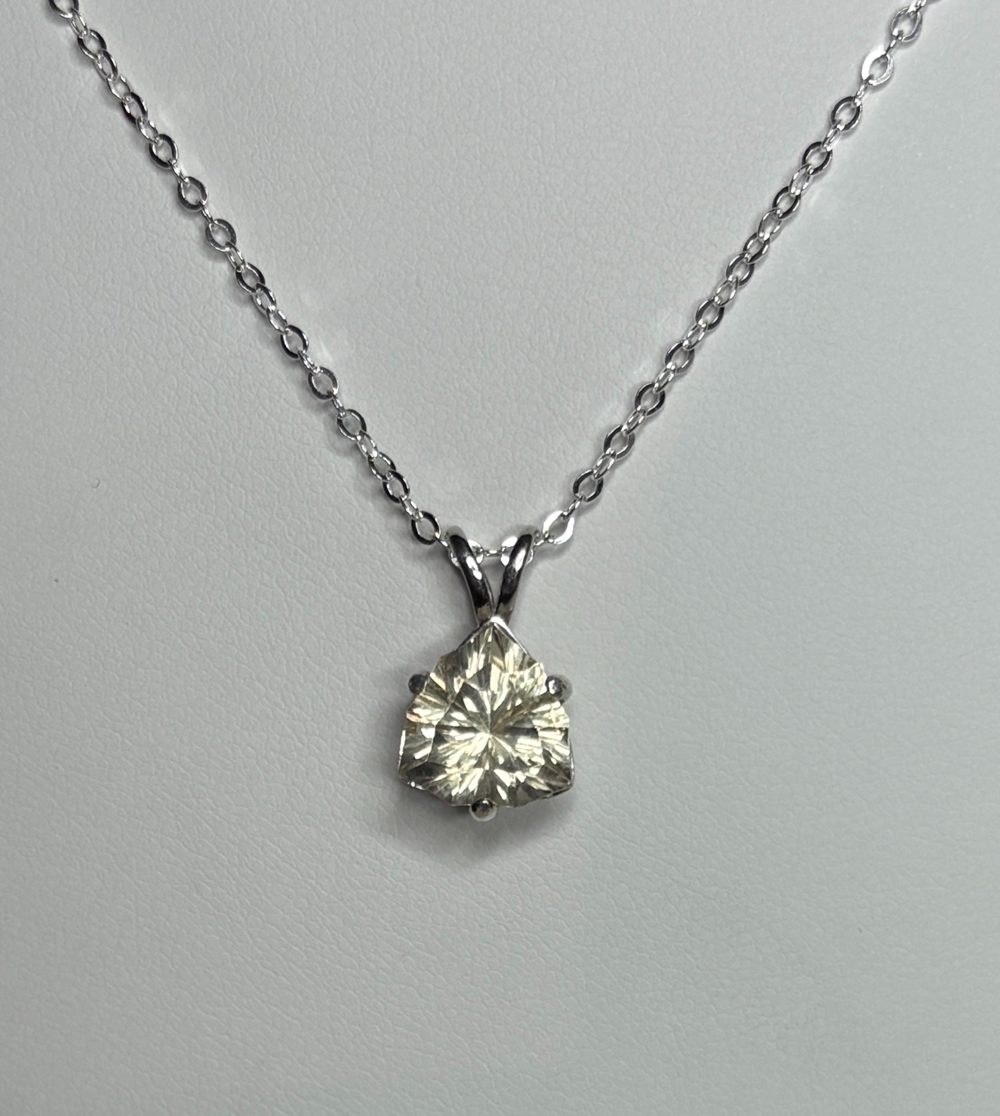 Sterling silver pendant necklace with a 10mm concave cut trillion Oregon sunstone.