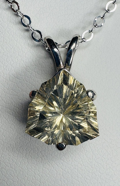 Sterling silver pendant necklace featuring a 10mm concave cut trillion Oregon sunstone.