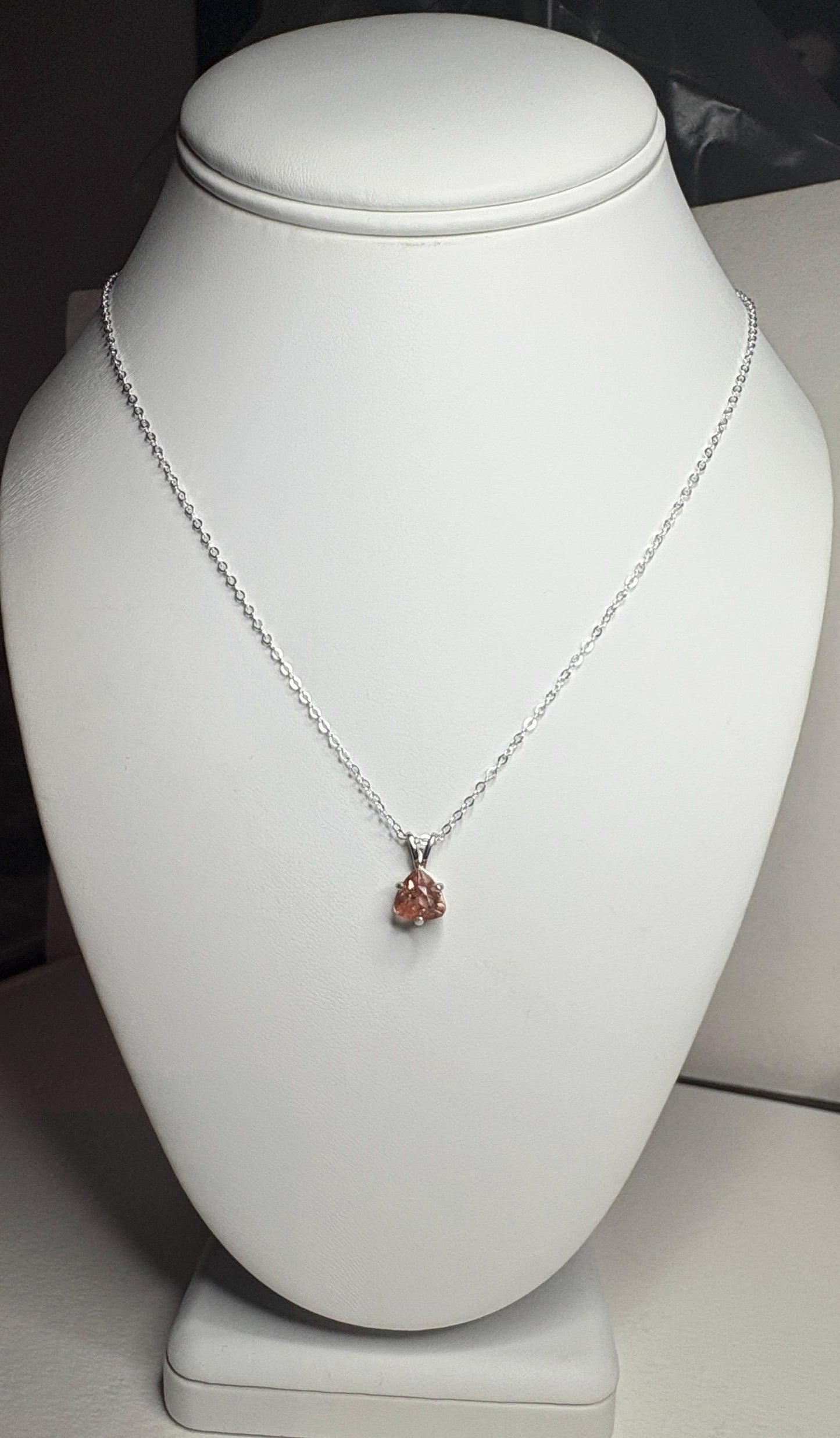 Sterling silver necklace with an 18 inch chain and a peach Oregon sunstone pendant.