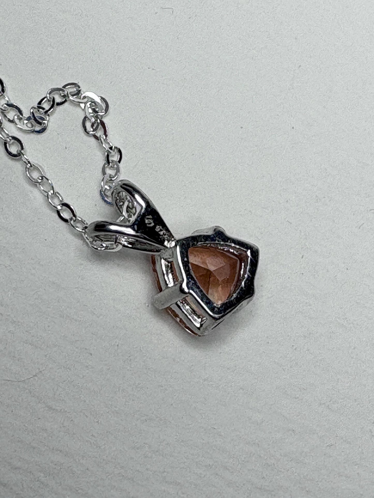 Sterling silver pendant necklace with an 8mm trillion peach Oregon sunstone.
