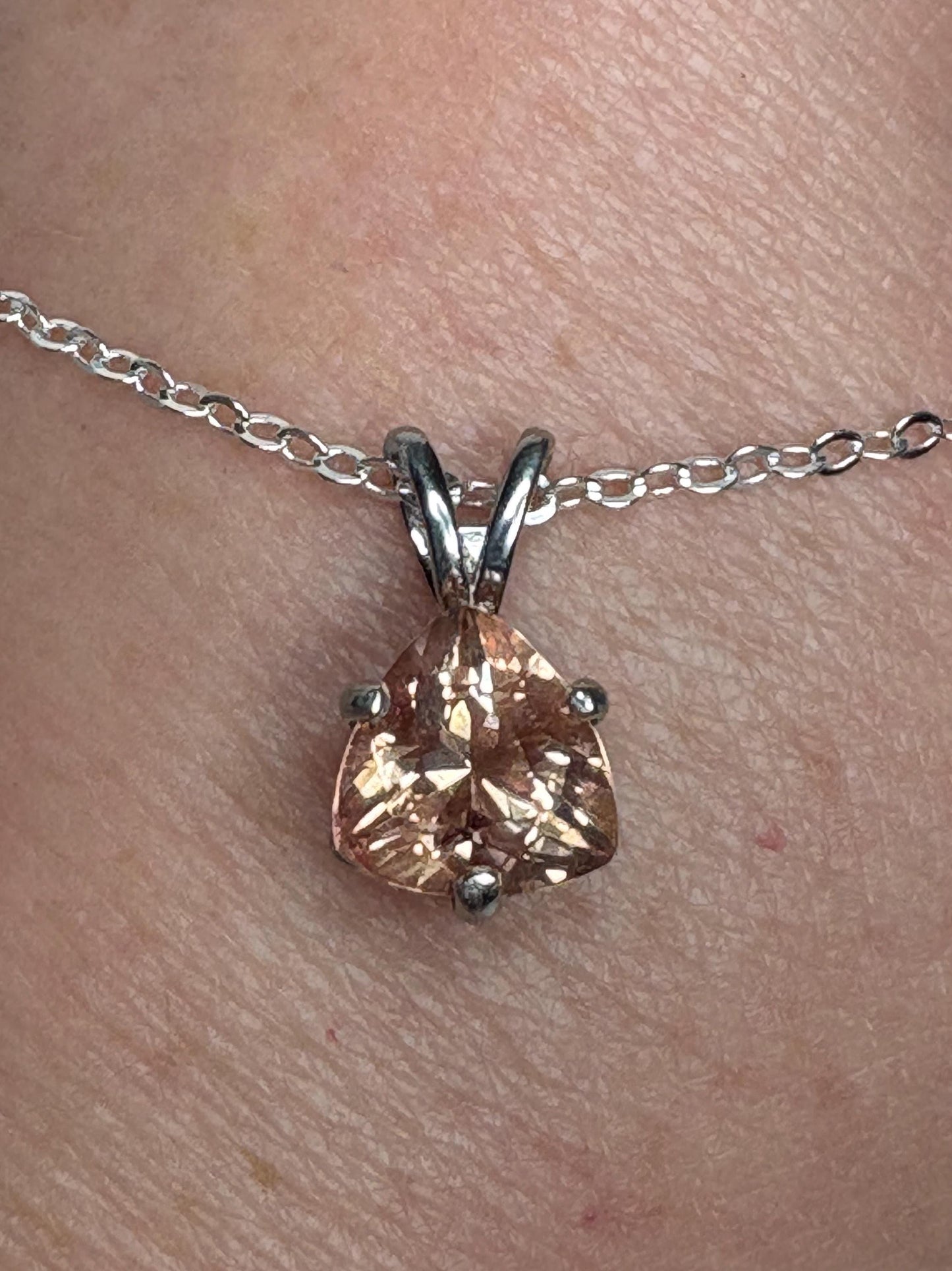 Sterling silver pendant necklace with a peach trillion-cut Oregon sunstone.