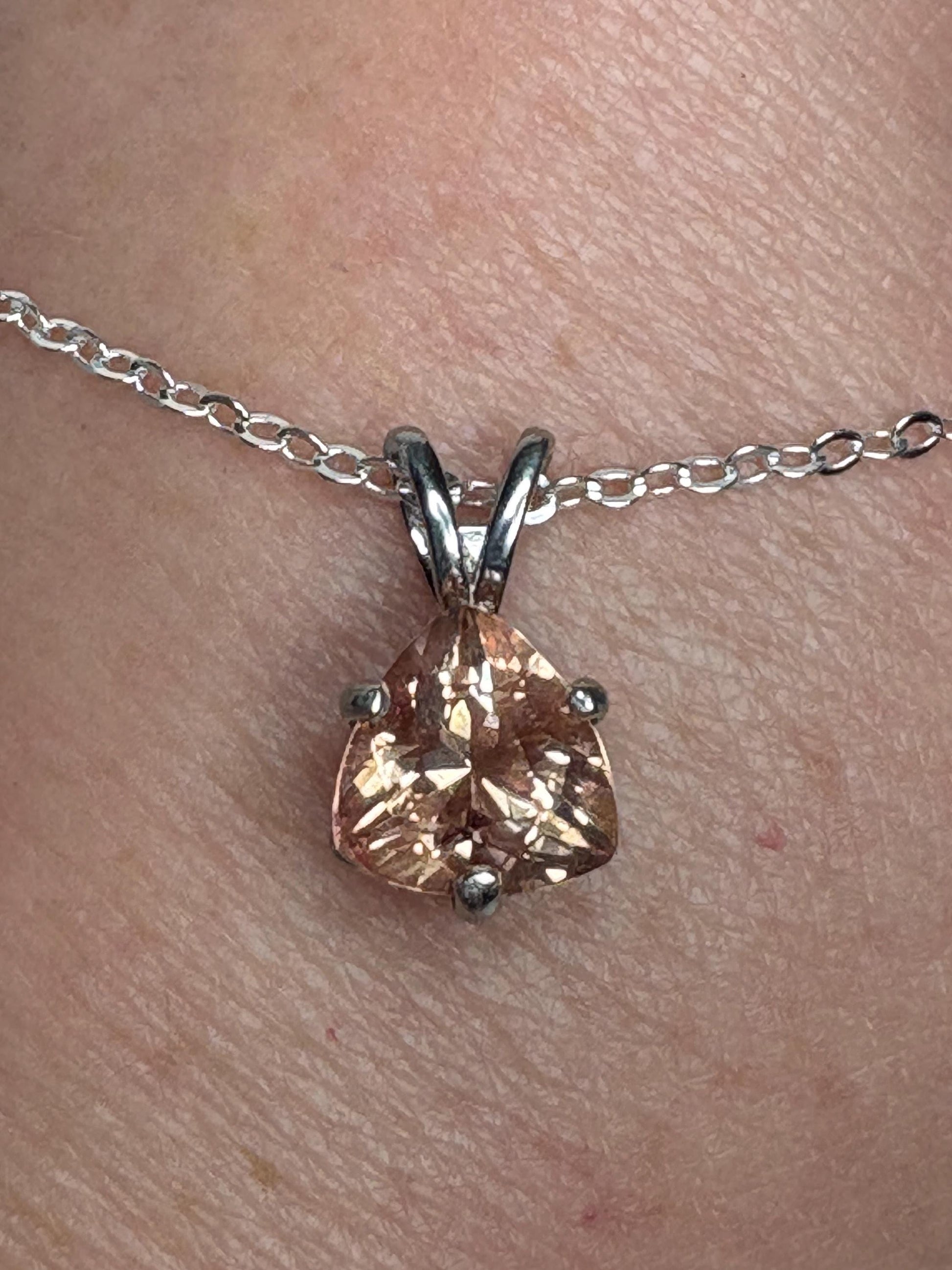 Sterling silver pendant necklace with a peach trillion-cut Oregon sunstone.