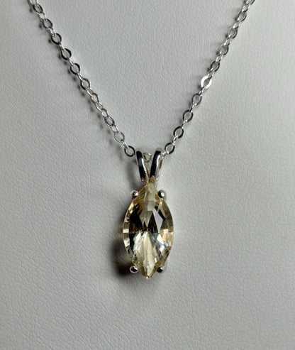 Sterling silver necklace with an 18-inch chain and a marquise-cut Oregon sunstone pendant.