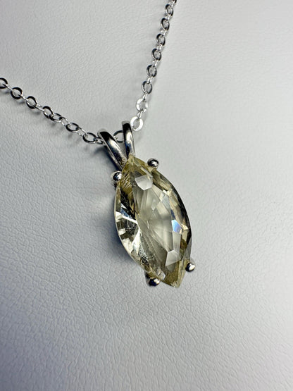Sterling silver necklace with a marquise-cut Oregon sunstone pendant.