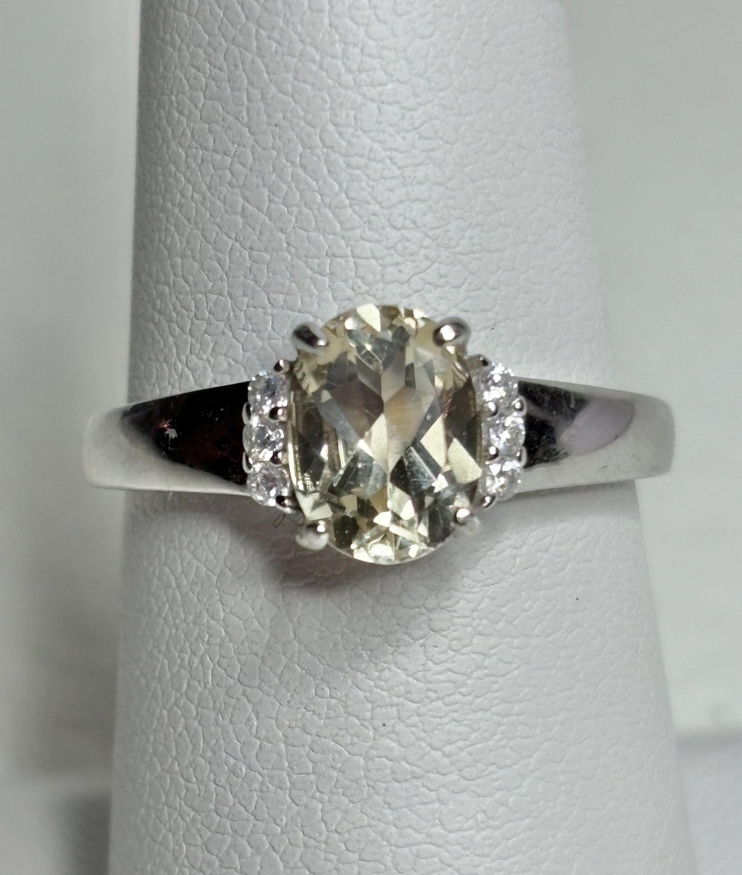 Sterling silver ring with an oval Oregon sunstone and accent crystals.