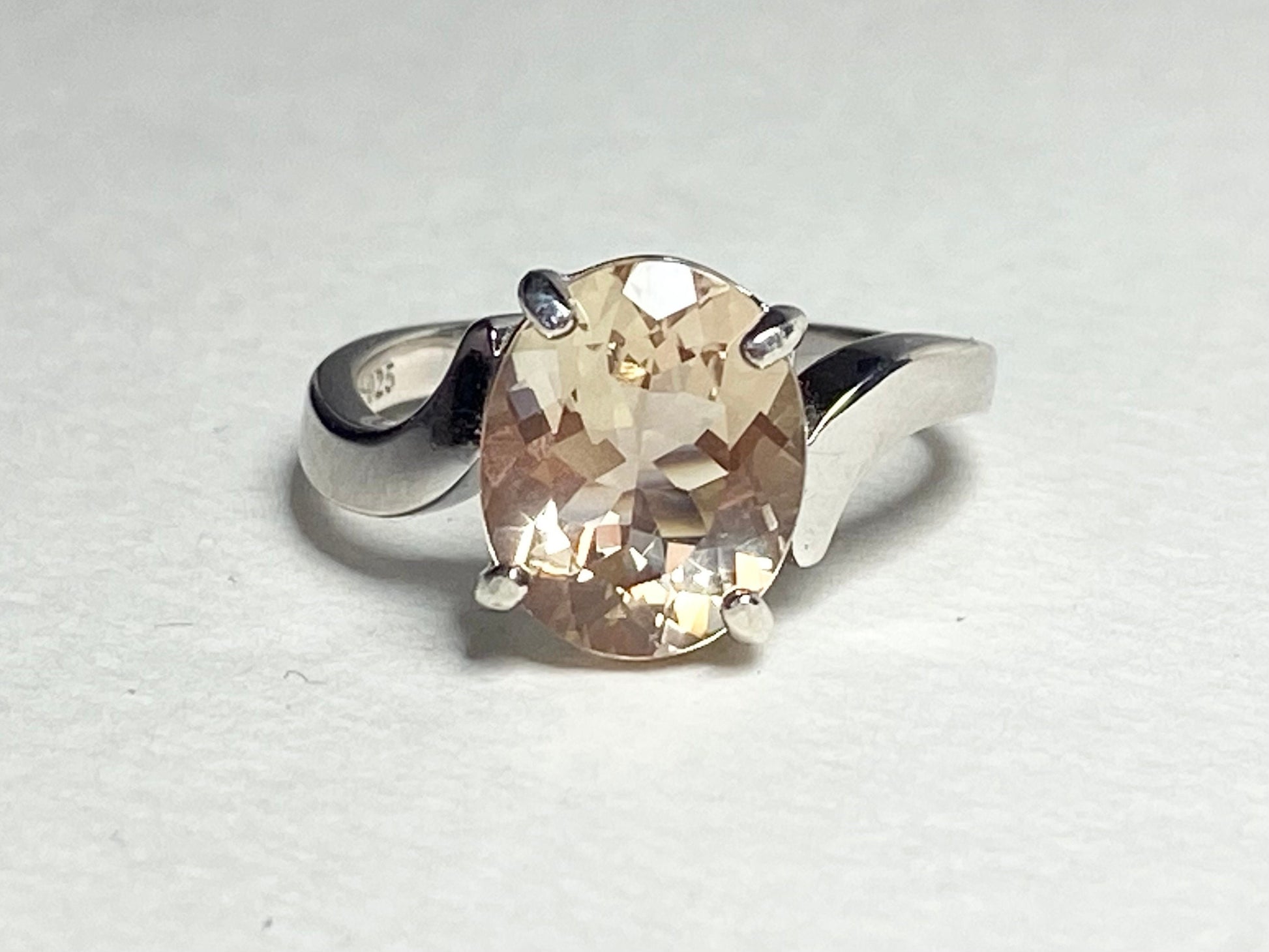 Oval champagne Oregon sunstone ring in sterling silver.