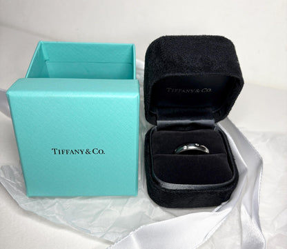 Tiffany & Co. platinum and diamond eternity band ring with box.